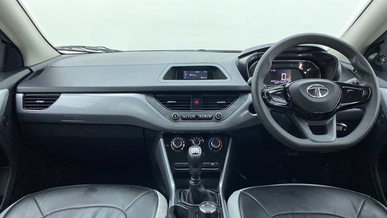 Dashboard and steering wheel view of a Tata Nexon 2017-2023