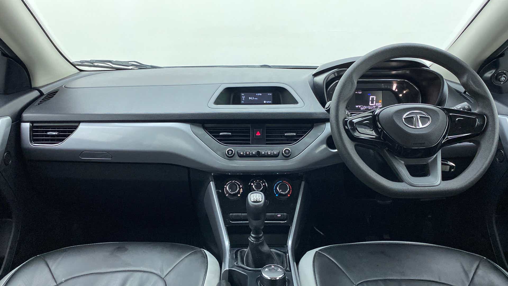 Dashboard and steering wheel view of a Tata Nexon 2017-2023