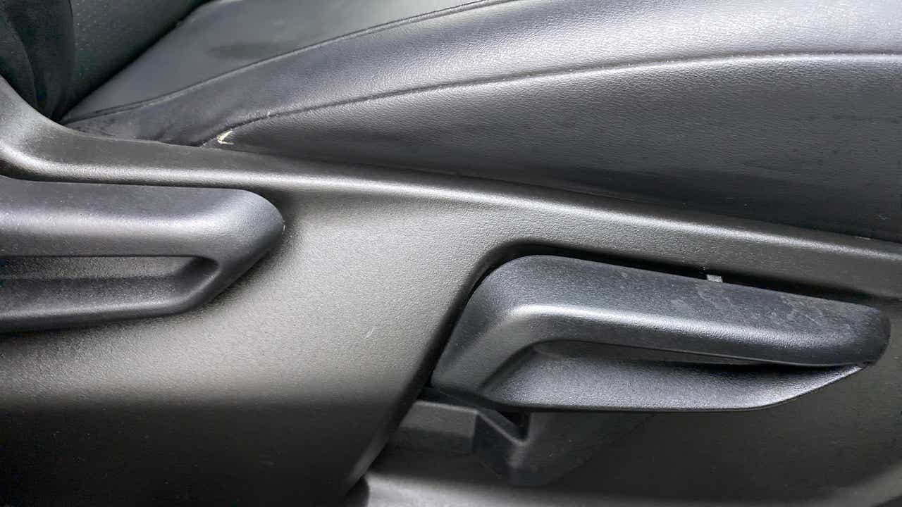Front seat adjustment lever close-up of a Tata Nexon 2017-2023