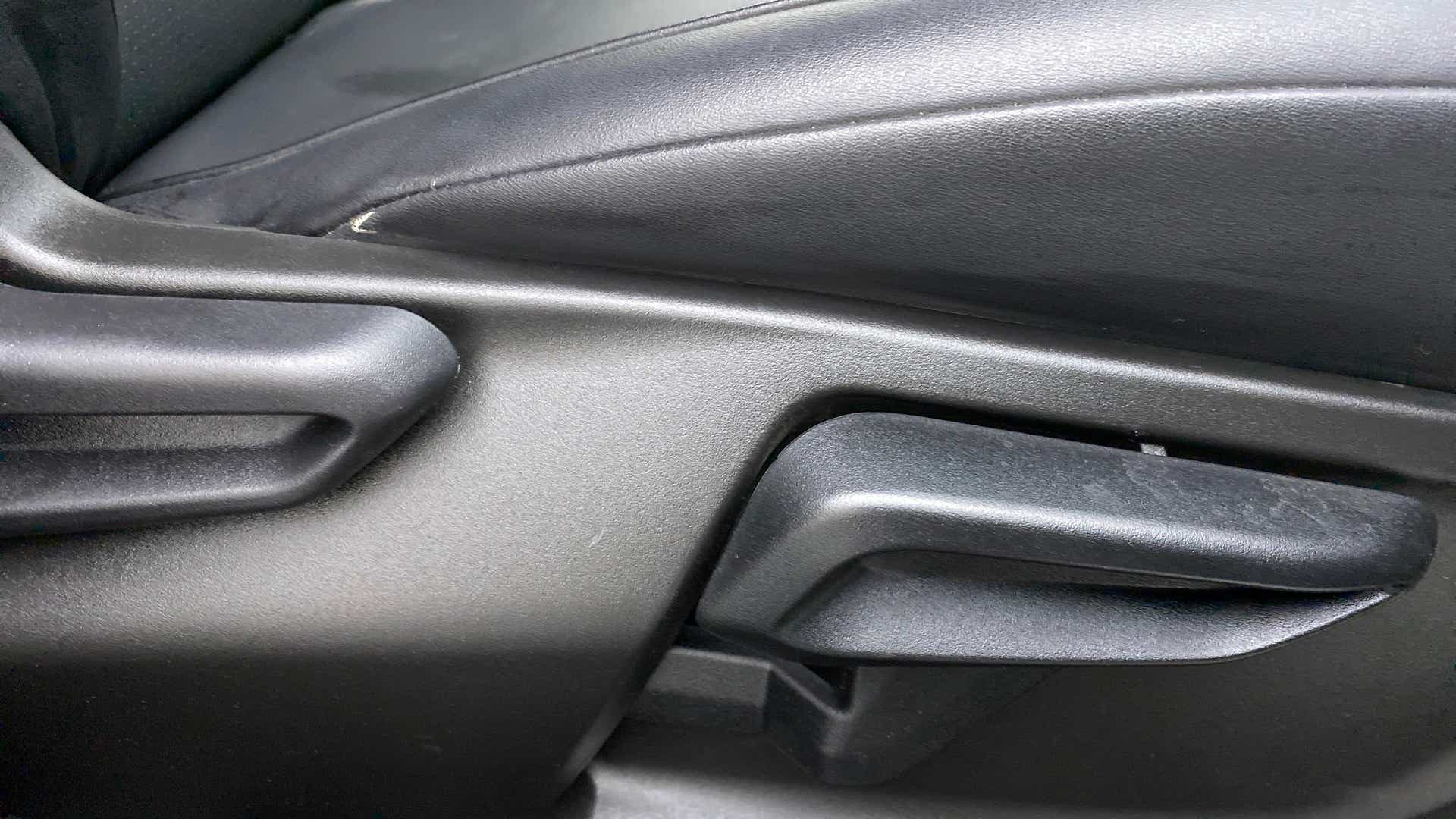 Front seat adjustment lever close-up of a Tata Nexon 2017-2023