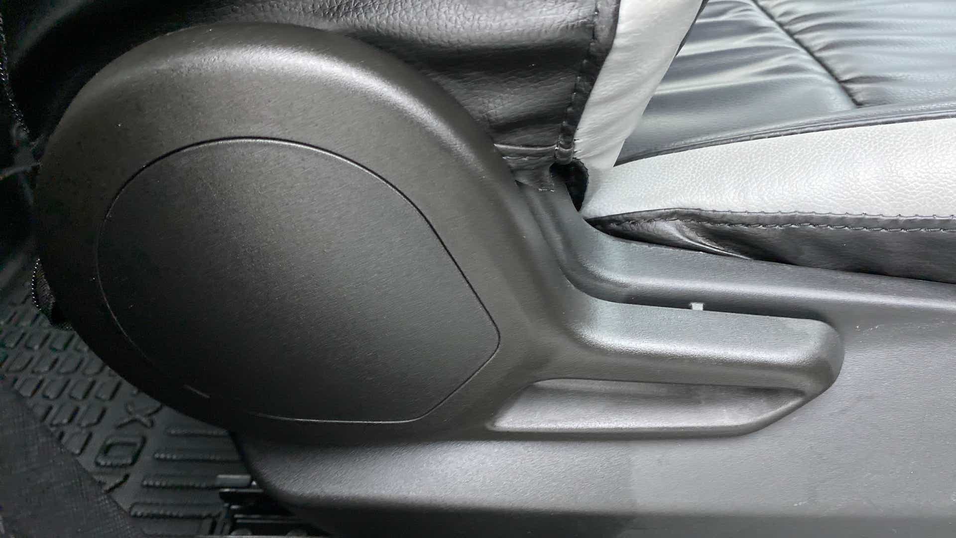 Seat adjustment lever close-up of a Tata Nexon 2017-2023