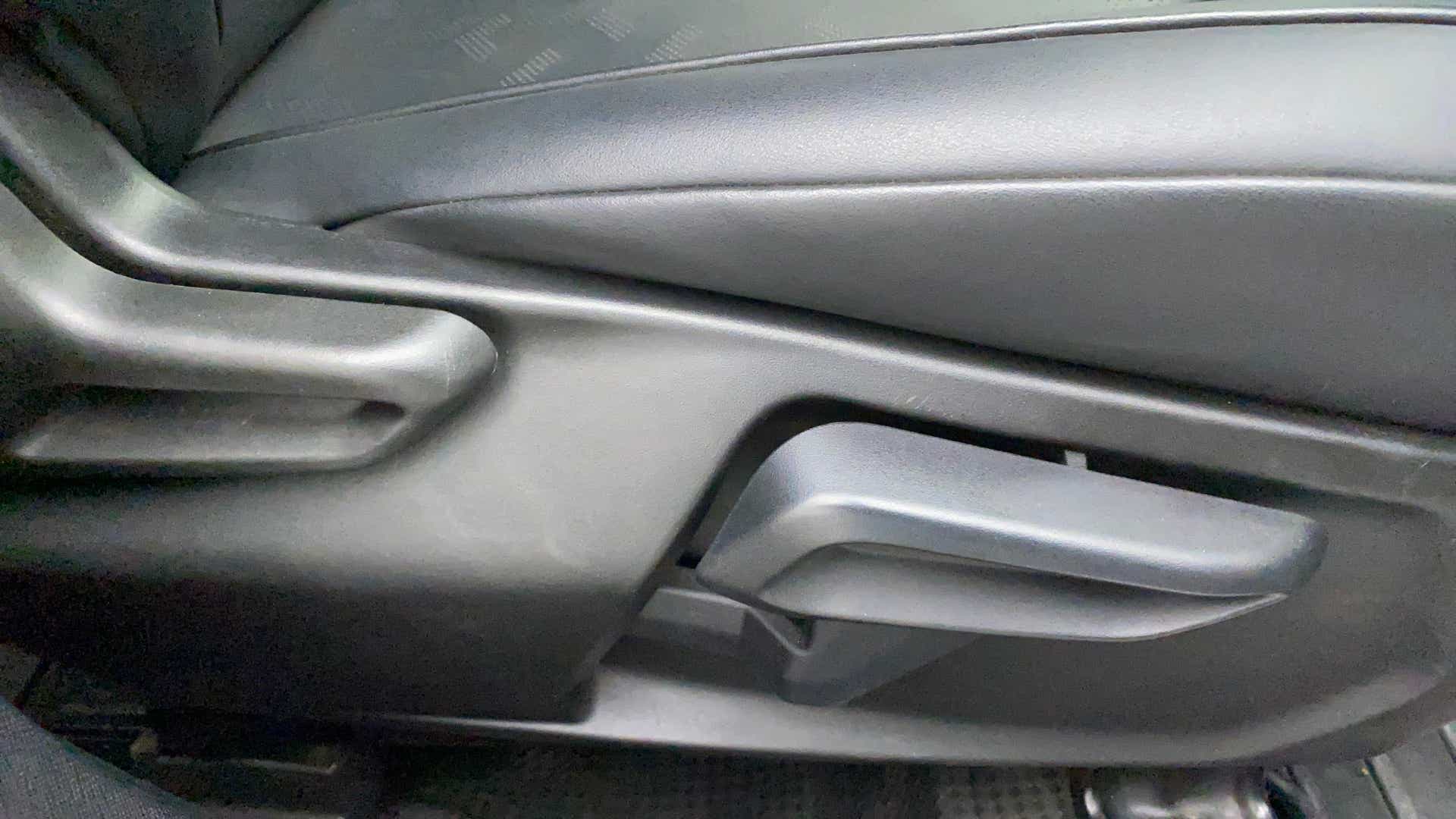 Close-up of a seat adjustment lever of a Tata Nexon 2017-2023