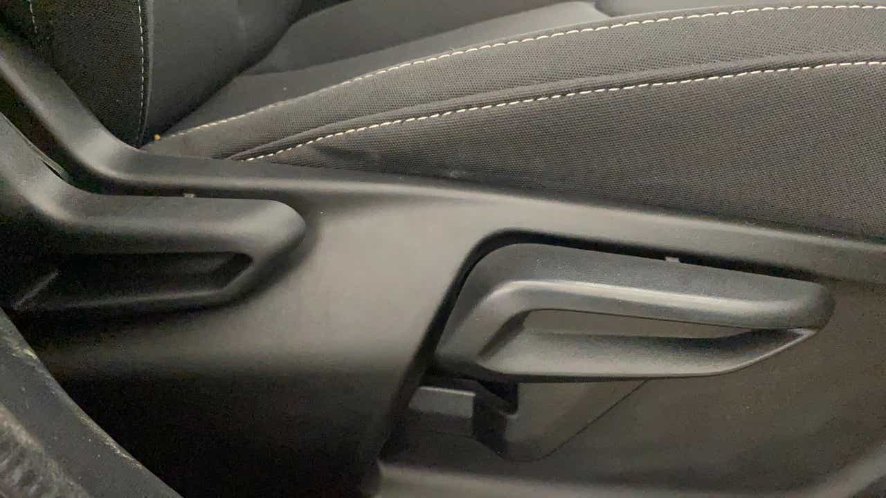 Close-up of seat adjustment lever in a Tata Nexon