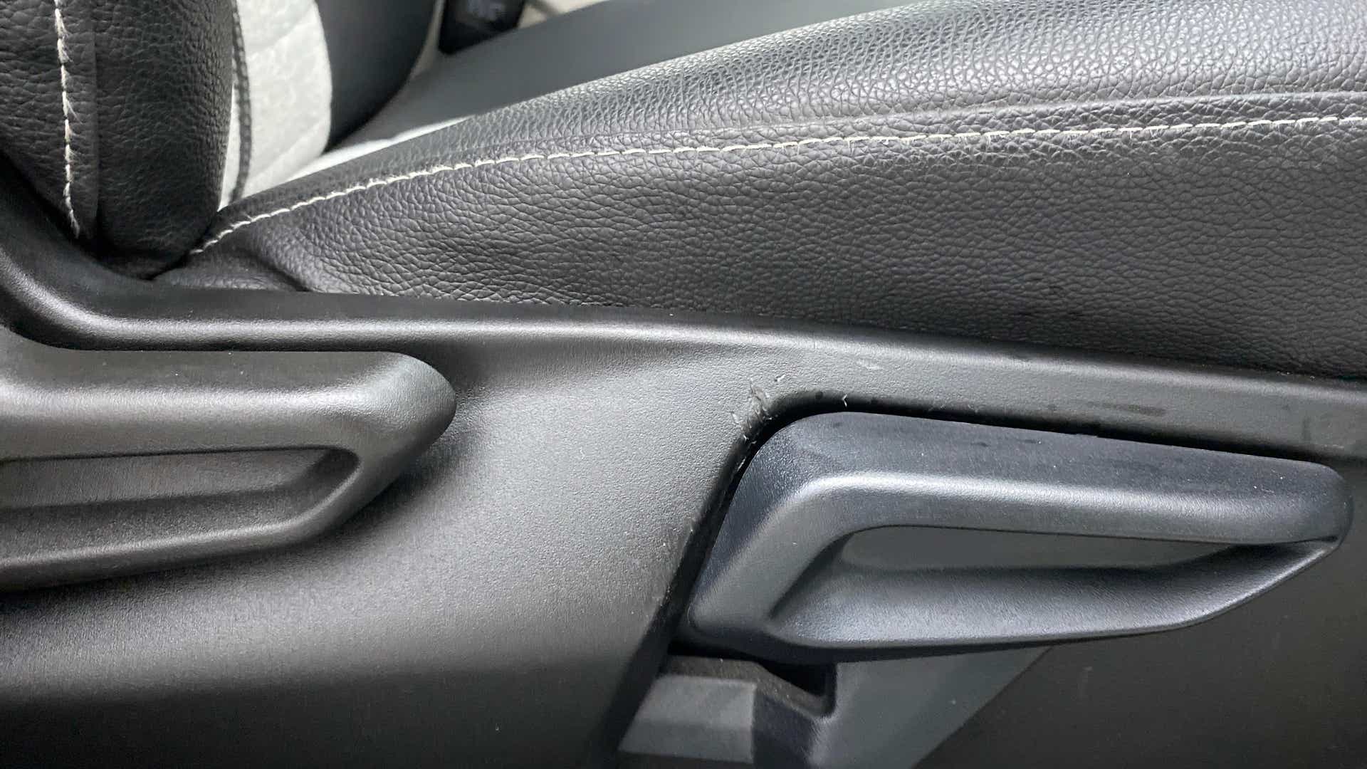 Close-up of a seat adjustment lever of a Tata Nexon 2017-2023