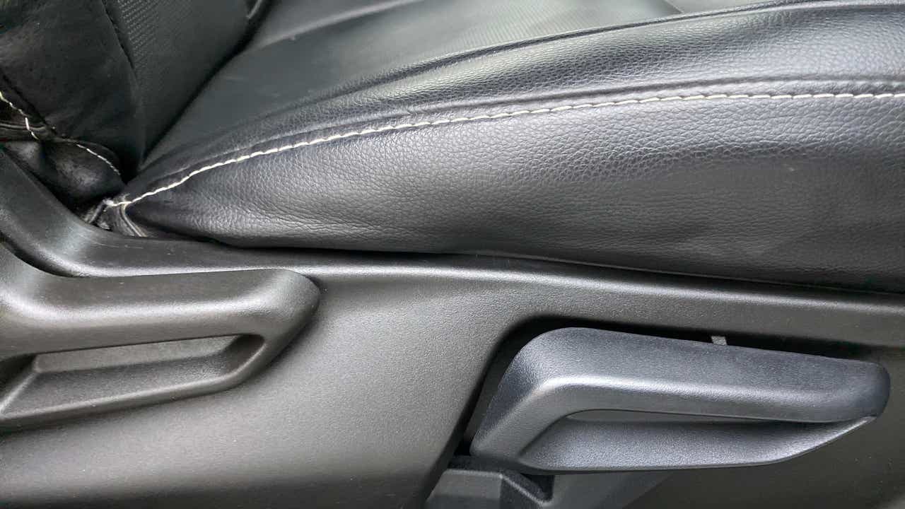 Close-up of a seat adjustment lever of a Tata Nexon 2017-2023