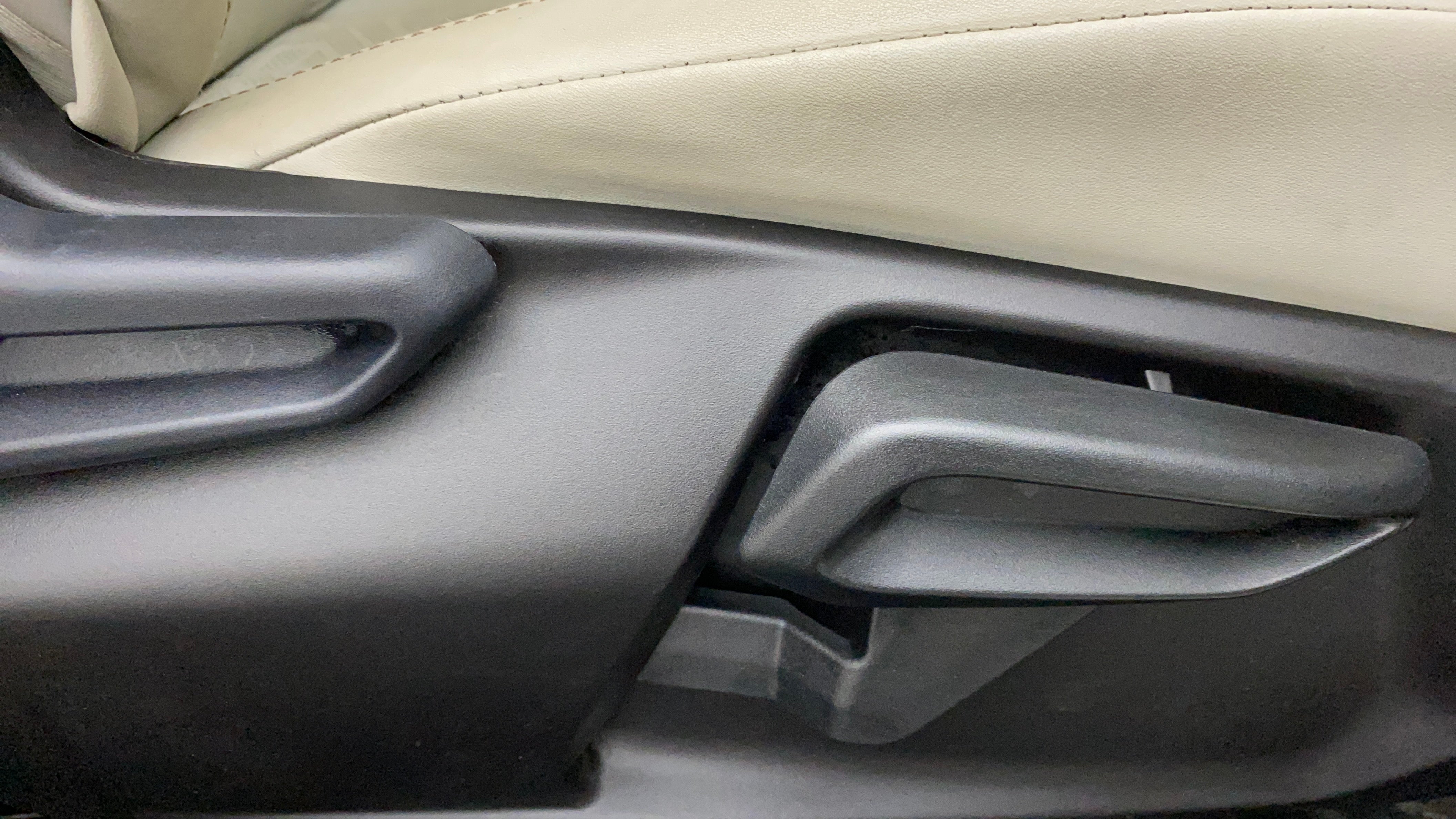 Driver seat adjuster lever of a Tata Nexon 2017-2023