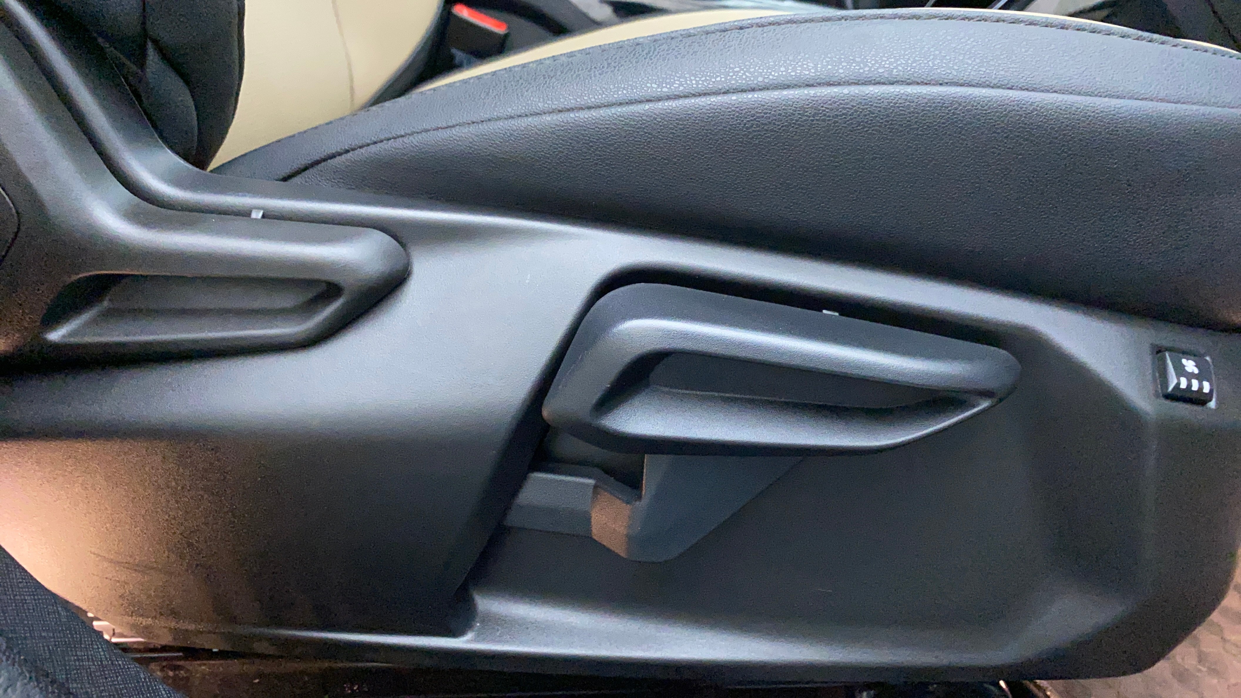 Seat adjustment lever area of a Tata Nexon 2017-2023