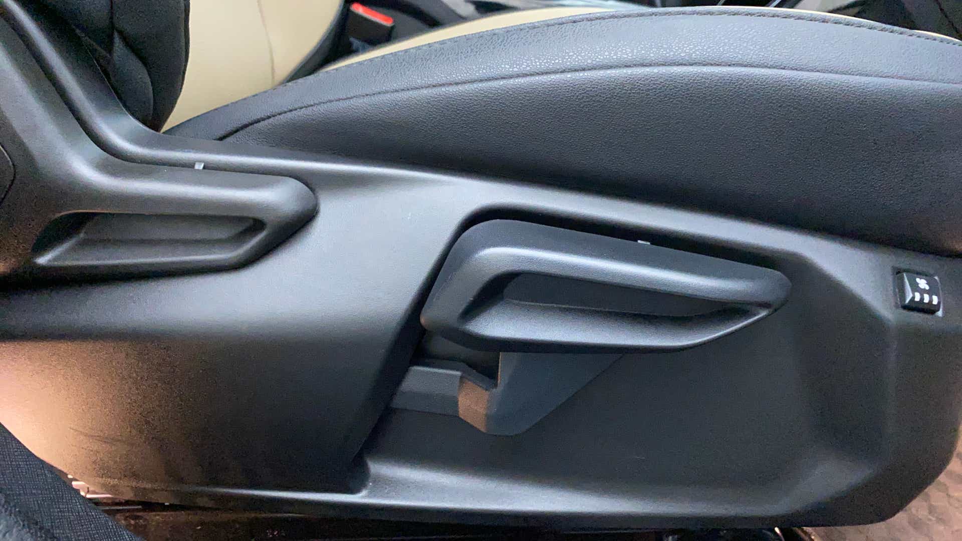 Seat adjustment lever area of a Tata Nexon 2017-2023