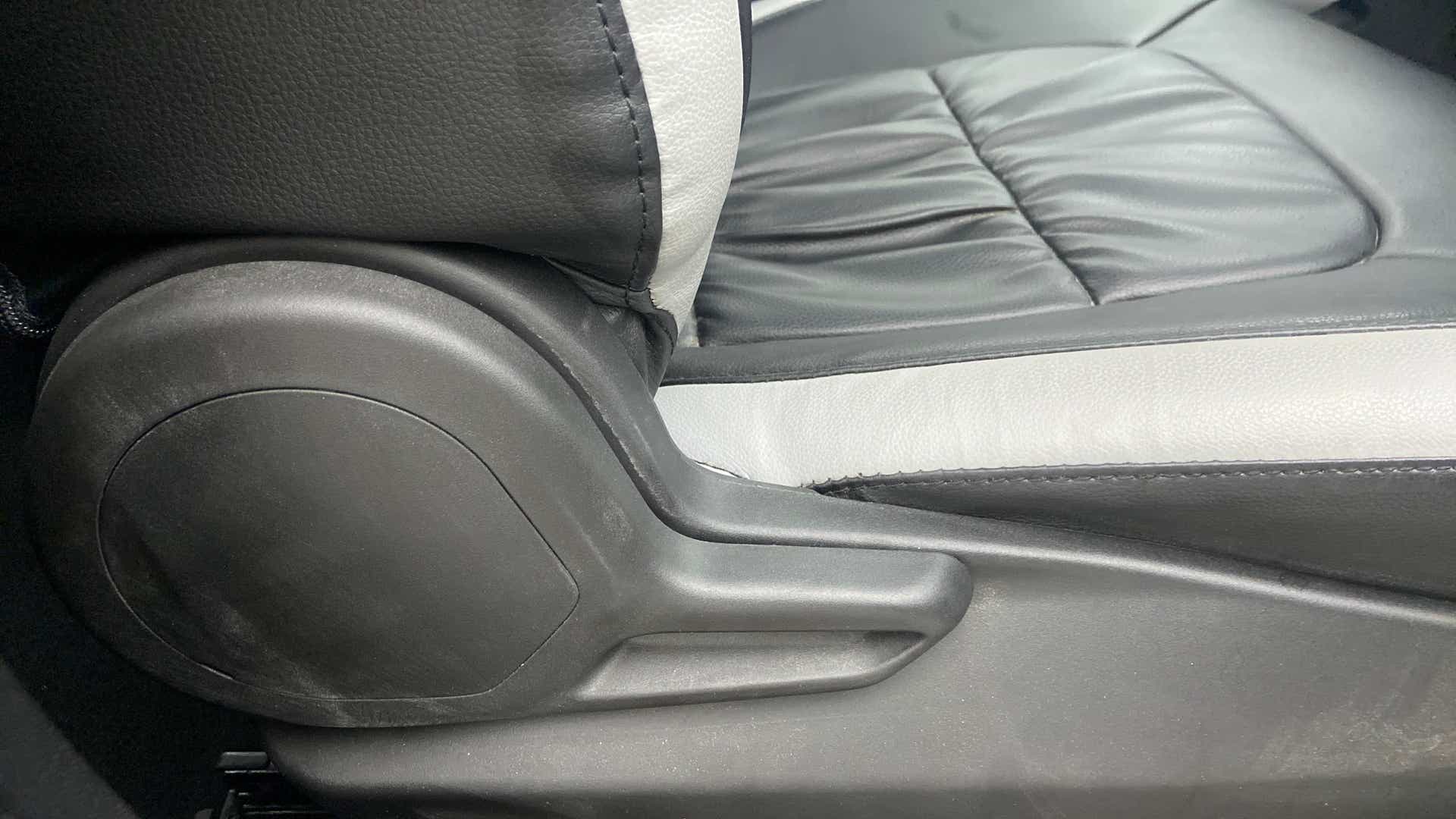 Driver seat adjustment lever close-up of a Tata Nexon 2017-2023