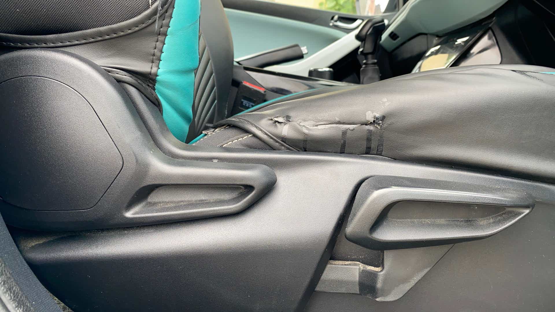 Close-up of a tata nexon front seat adjustment lever
