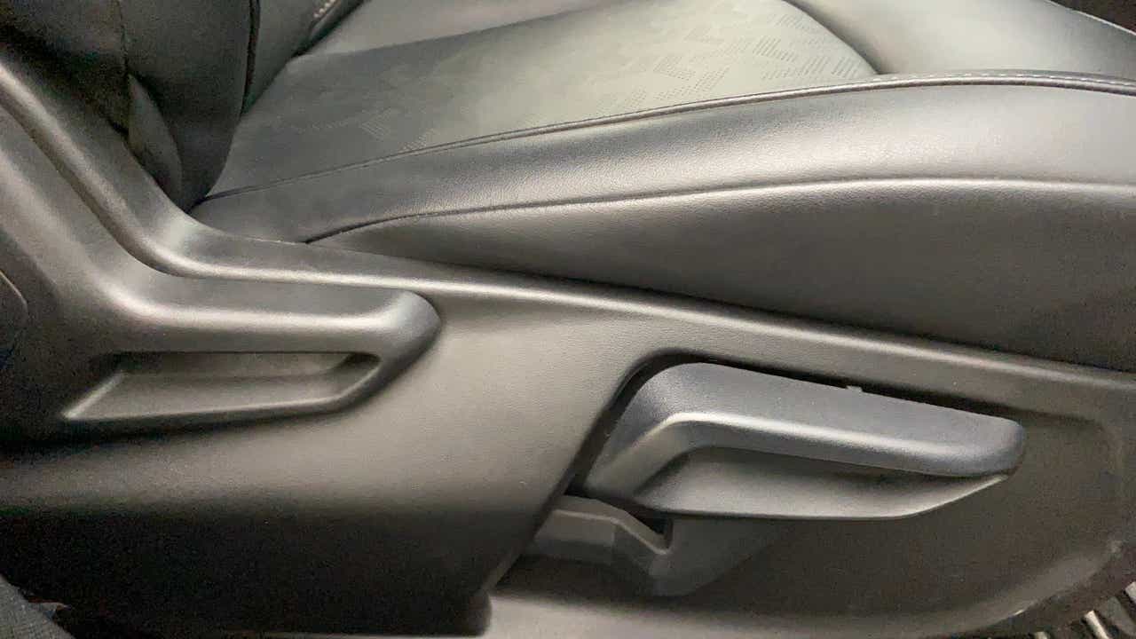 Close-up of the seat adjustment lever of a Tata Nexon 2017-2023