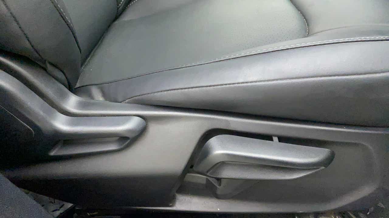 Close-up of the seat adjustment lever of a Tata Nexon 2017-2023