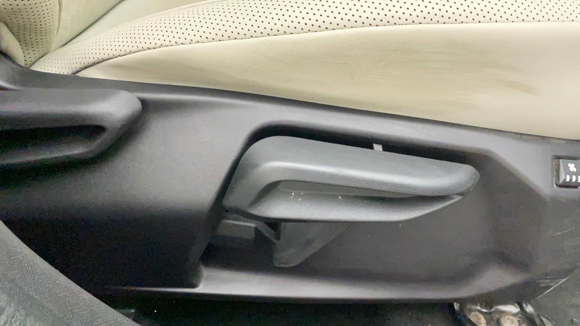 Driver seat adjustment lever of a Tata Nexon 2017-2023