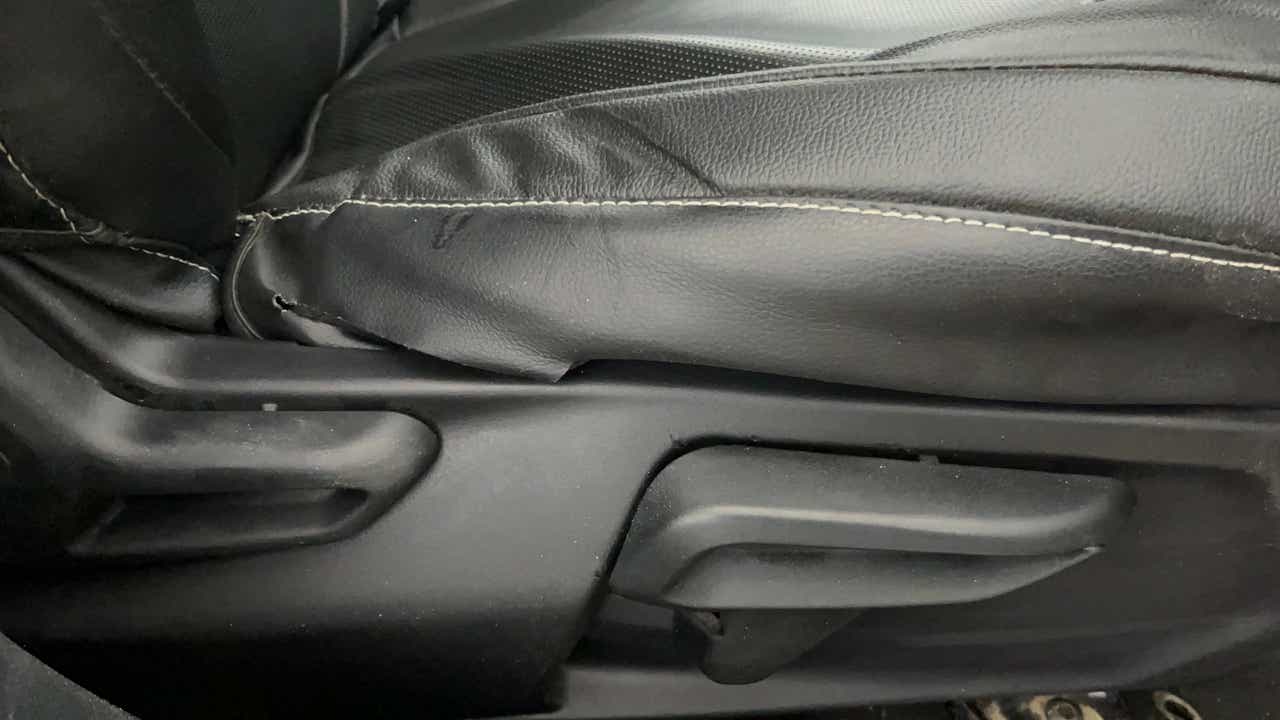 Close-up view of a Tata Nexon 2017-2023 seat adjustment lever