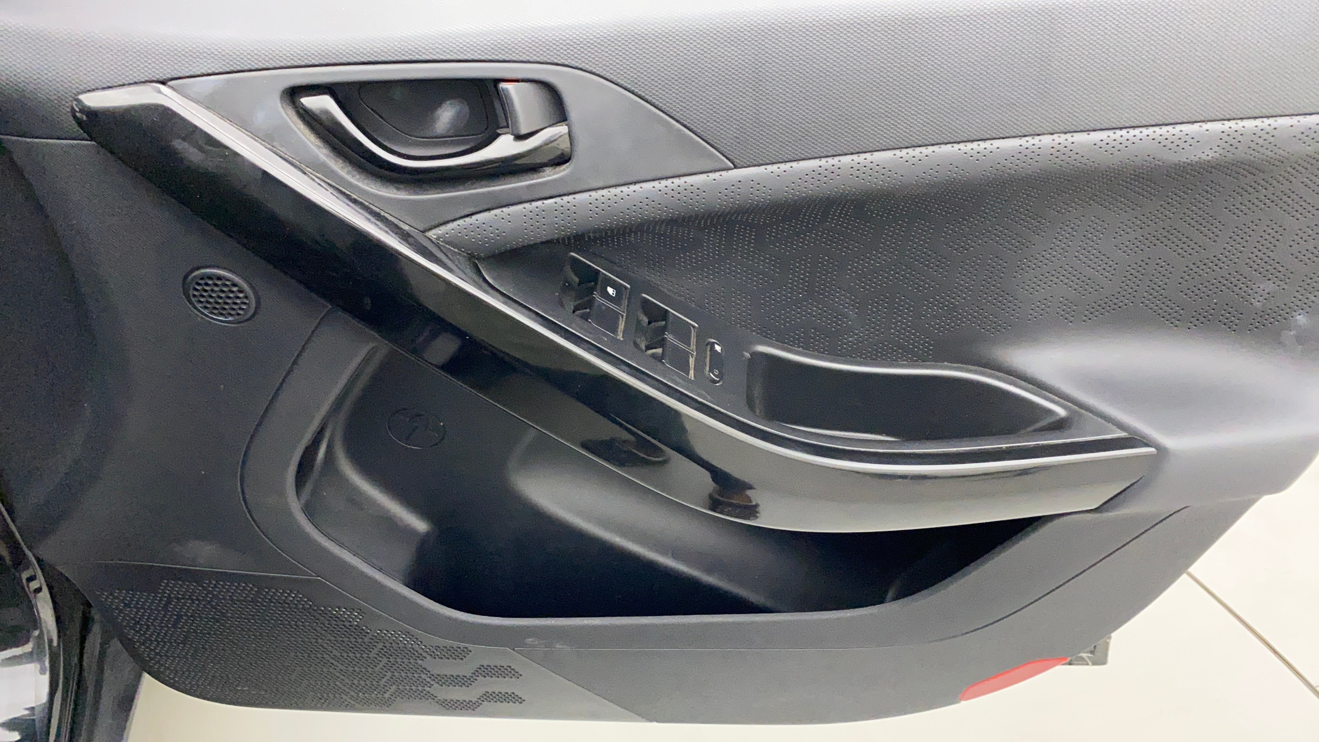 Interior driver-side door panel of a Tata Nexon 2017-2023