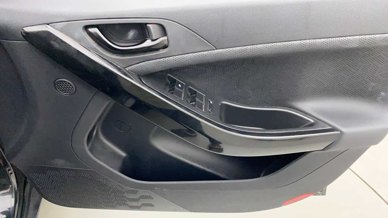 Interior driver-side door panel of a Tata Nexon 2017-2023
