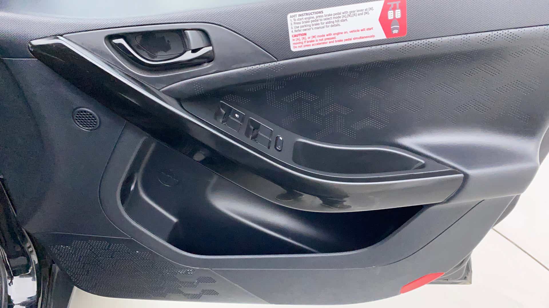Interior driver side door panel of a Tata Nexon 2017-2023