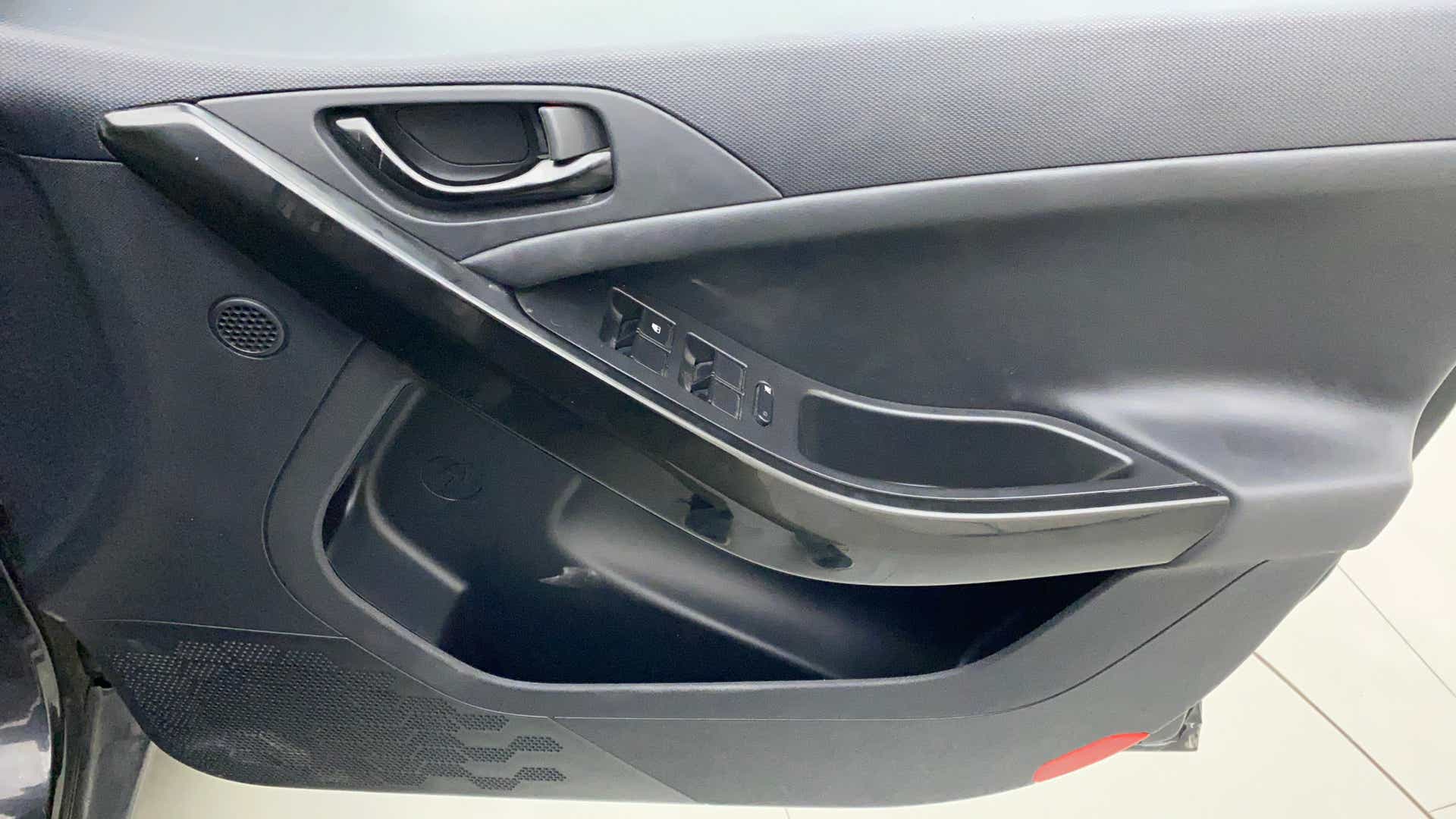 Interior driver-side door panel of a Tata Nexon 2017-2023