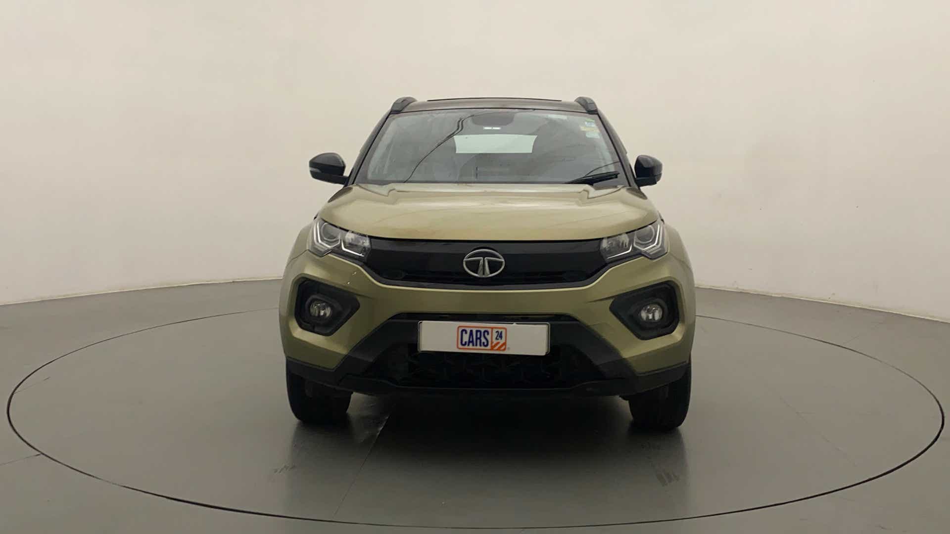 Front view of a Grassland Beige Tata Nexon 2017-2023