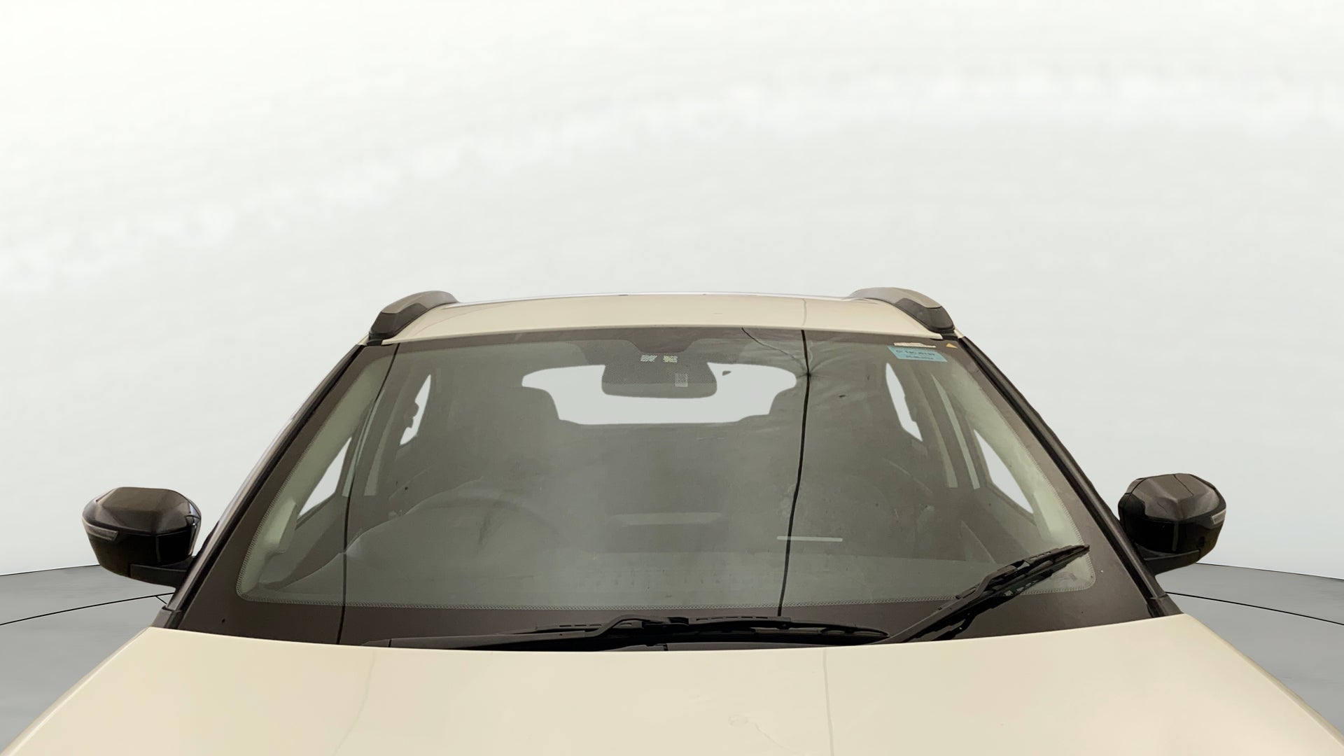 Front windshield and mirrors of a Tata Nexon