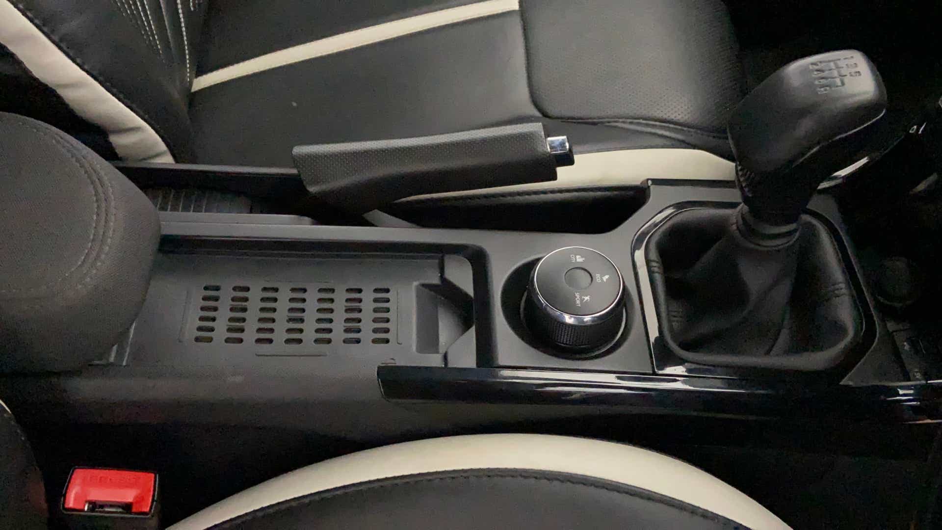 Center console with gear lever and control knob of a Tata Nexon 2017-2023