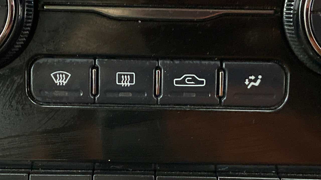 Dashboard climate control buttons of a Tata Nexon 2017-2023