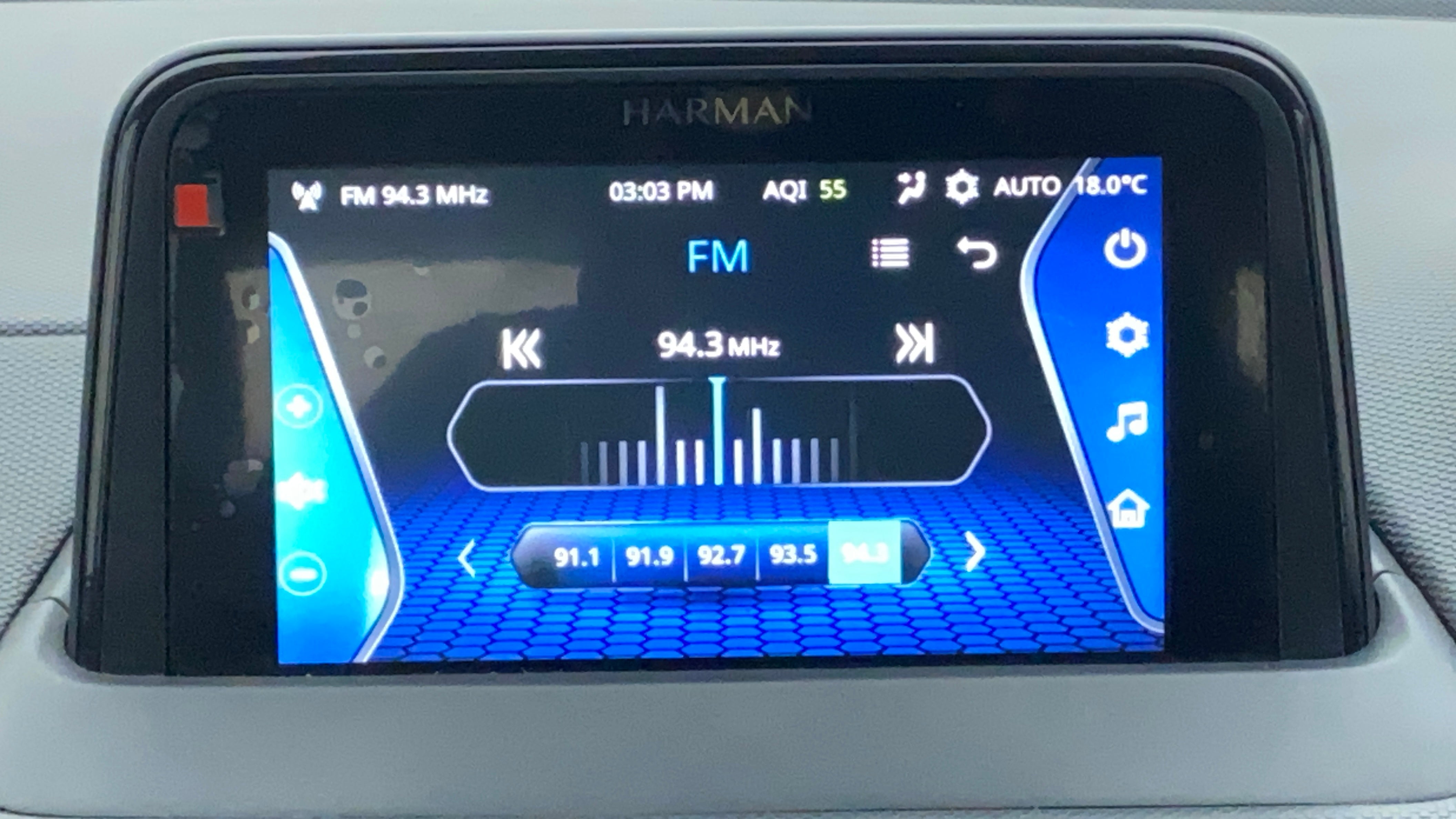 Car infotainment system showing FM radio interface of a Tata Nexon 2017-2023