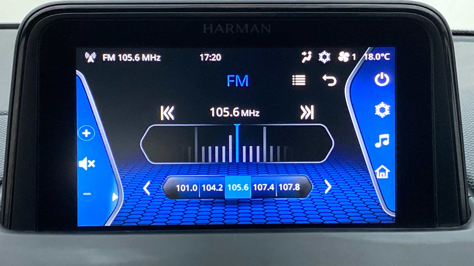 Infotainment display showing FM radio of a Tata Nexon 2017-2023