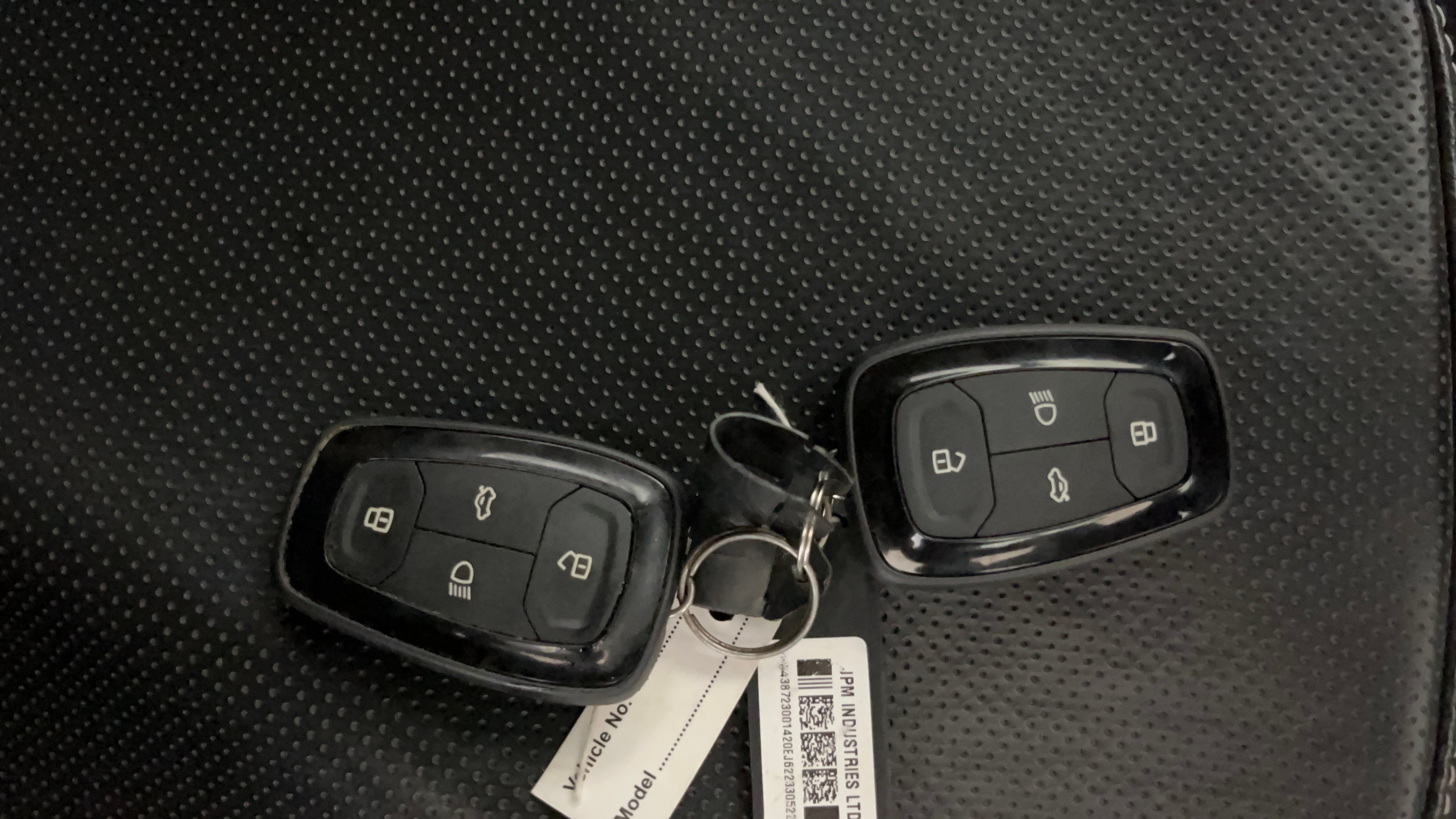 Car key fobs on a seat of a Tata Nexon 2017-2023