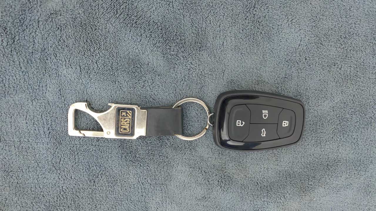 Top view of a Tata Nexon 2017-2023 key fob with keychain