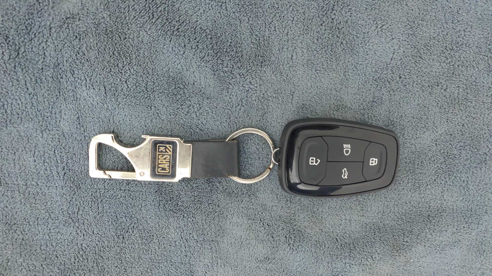Top view of a Tata Nexon 2017-2023 key fob with keychain