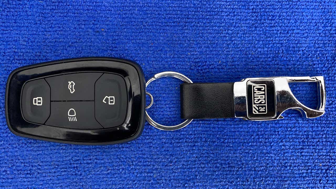 Car key fob with a Cars24 keychain for a Tata Nexon 2017-2023