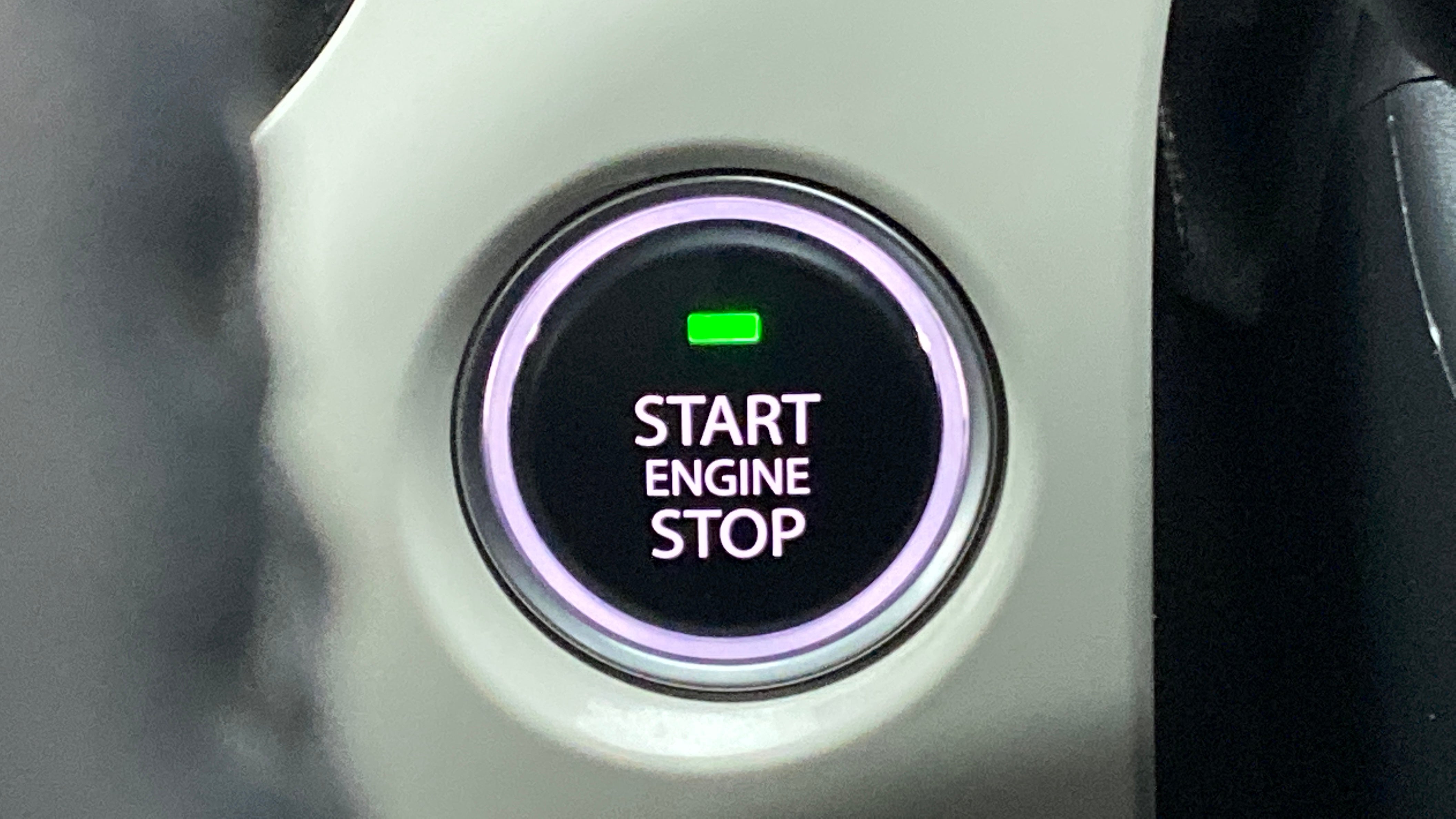 Close-up of engine start stop button in a Tata Nexon 2017-2023