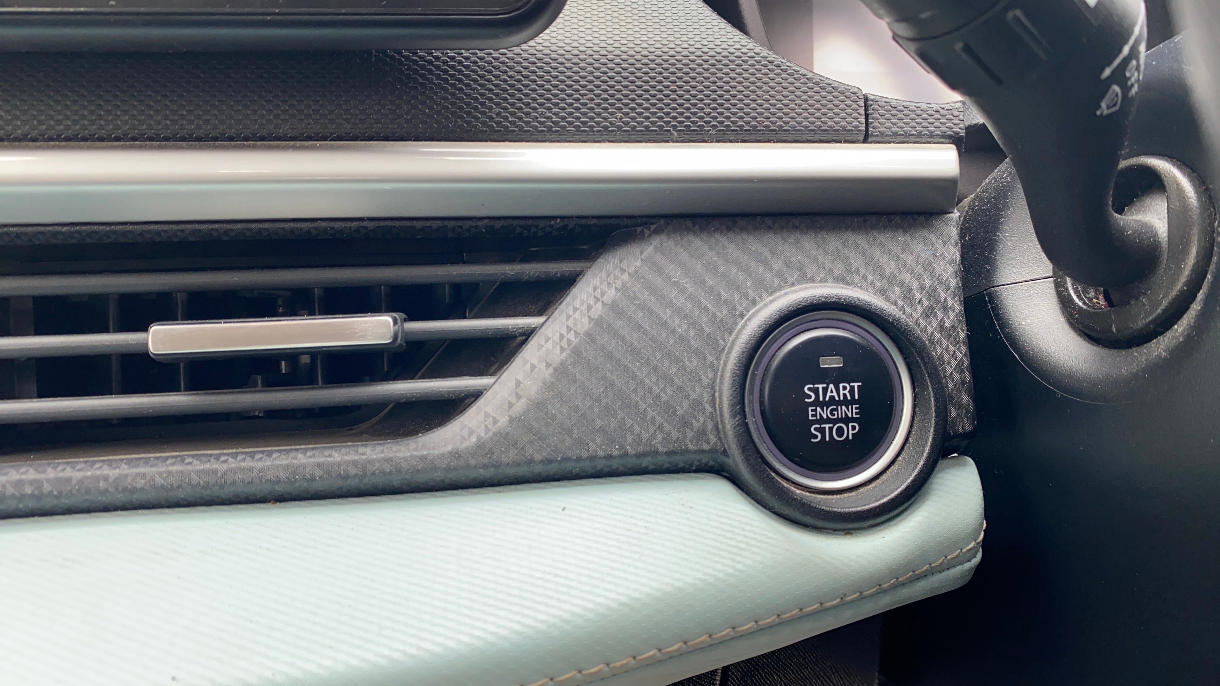 Dashboard start button view of a Tata Nexon