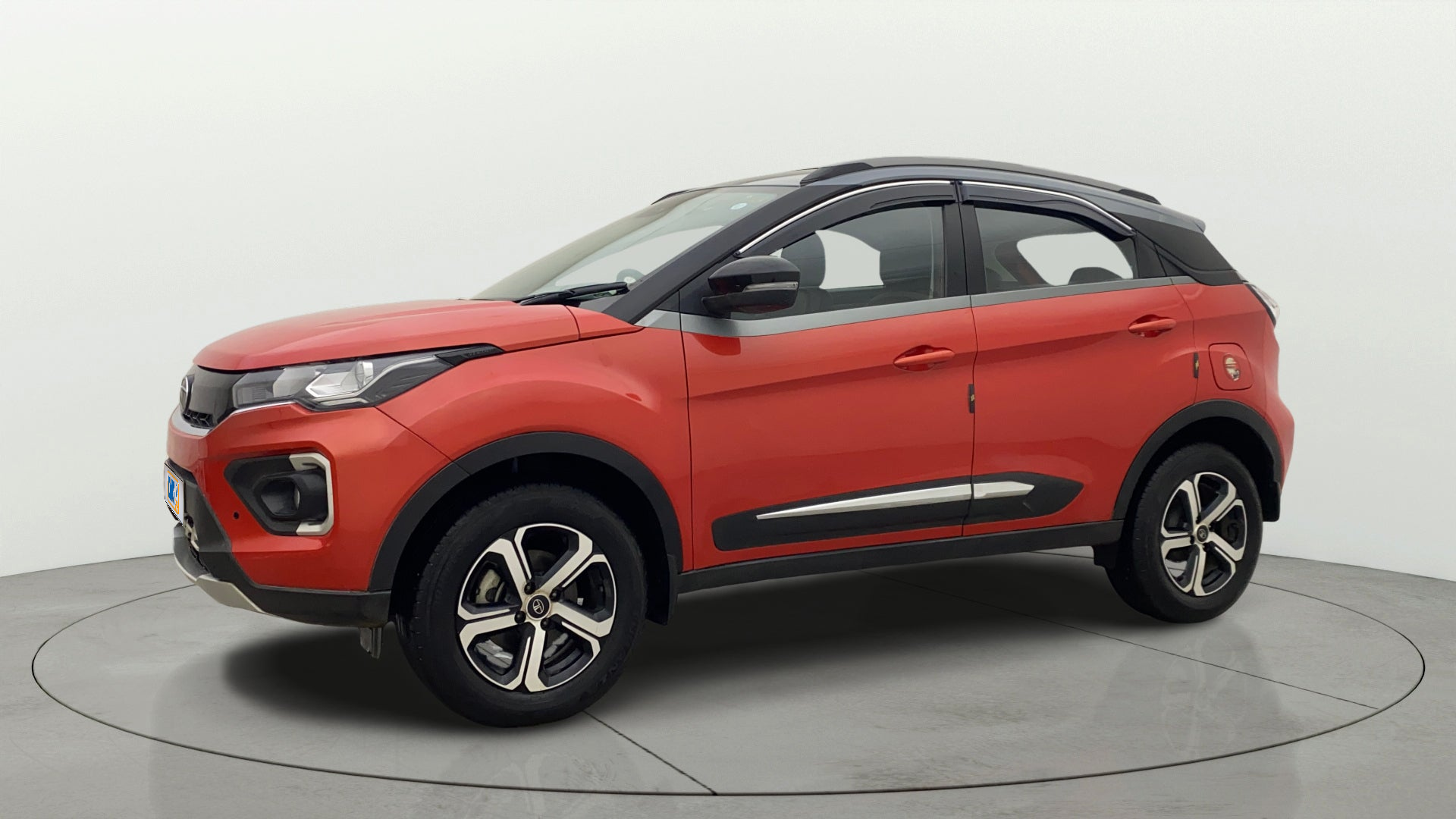 Front side view of a Flame Red Tata Nexon 2017-2023
