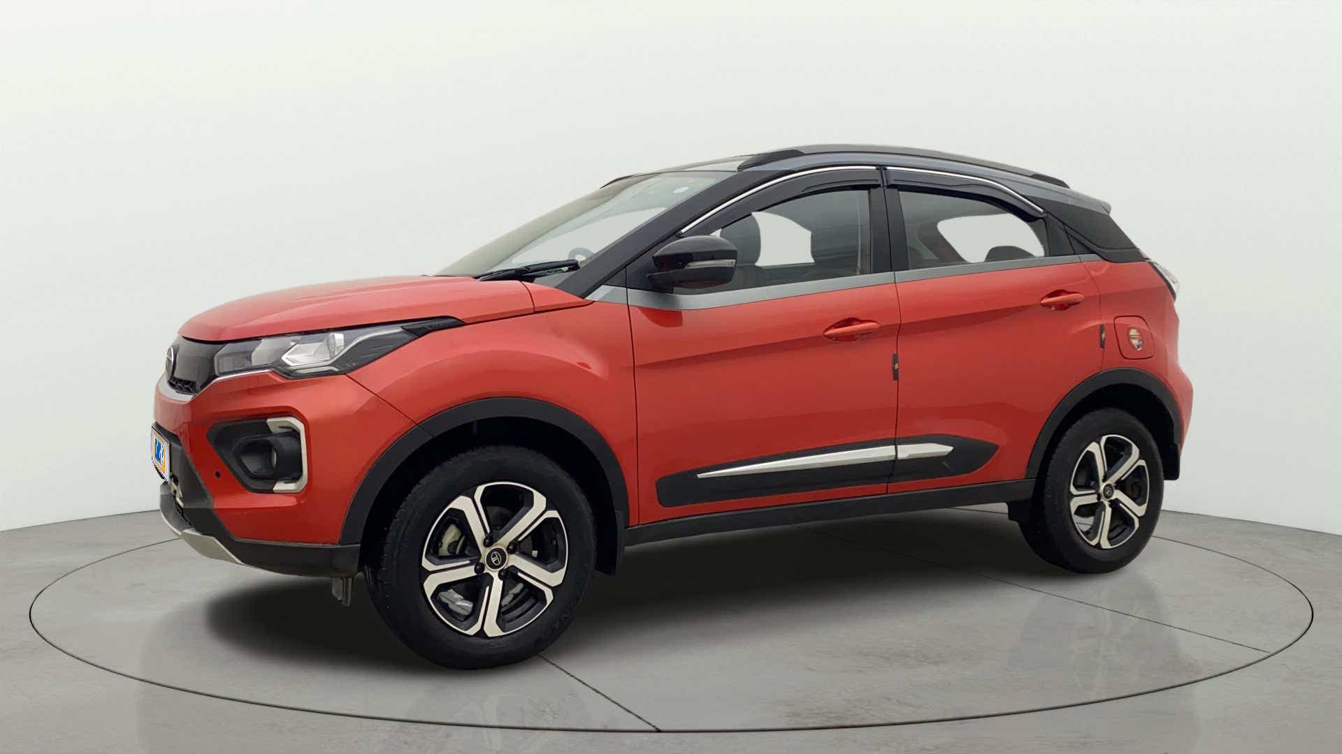 Front side view of a Flame Red Tata Nexon 2017-2023