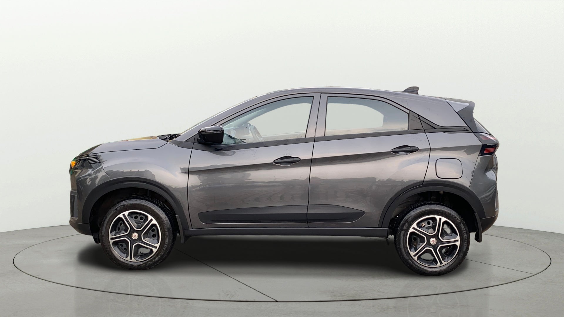 Side view of a daytona-grey Tata Nexon