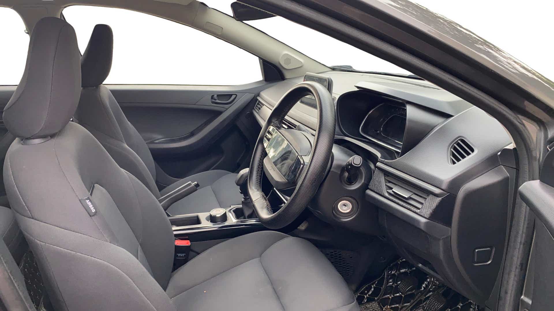Interior dashboard and front seats of a Tata Nexon