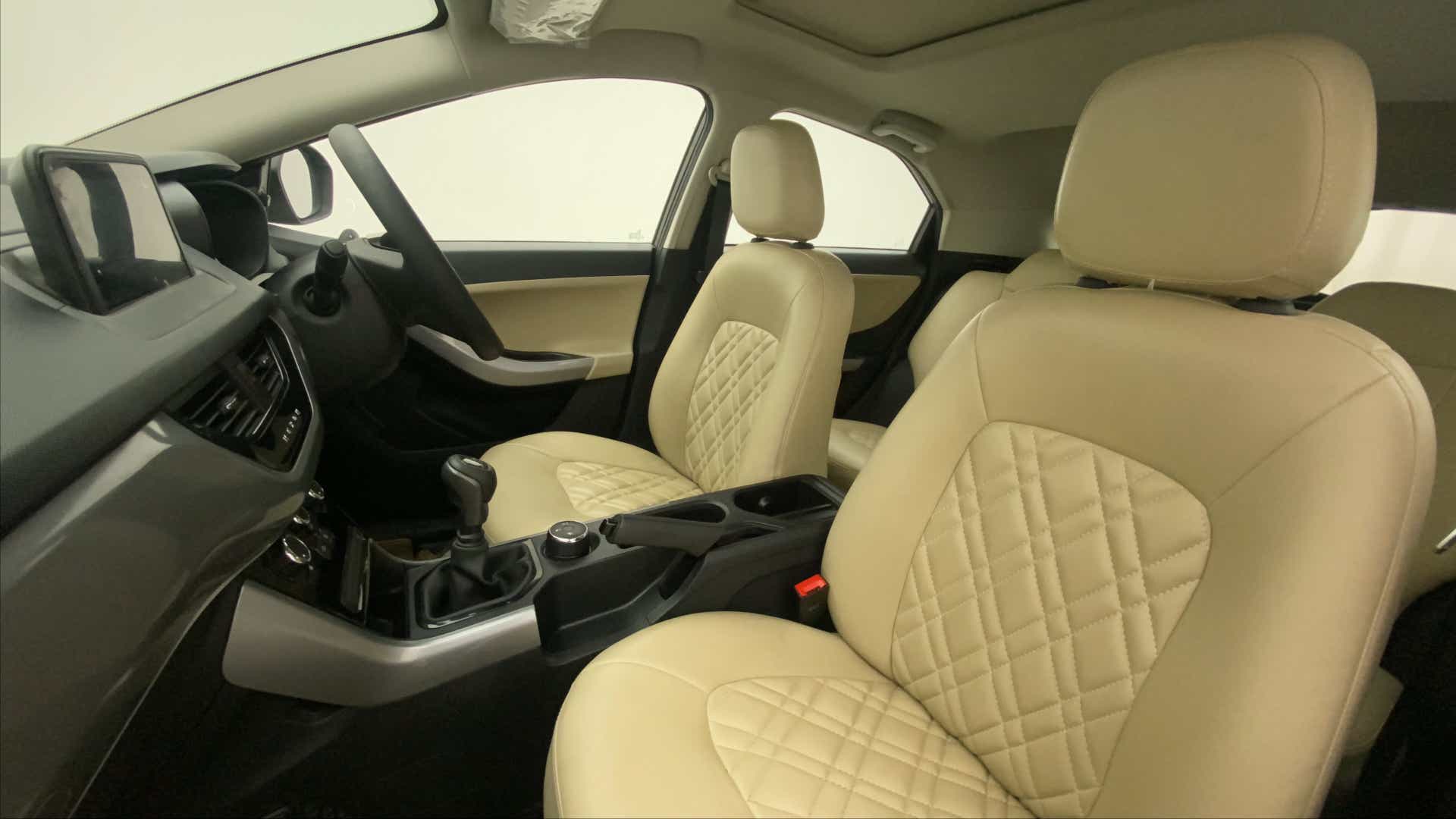 Interior front seats and dashboard of a Tata Nexon 2017-2023