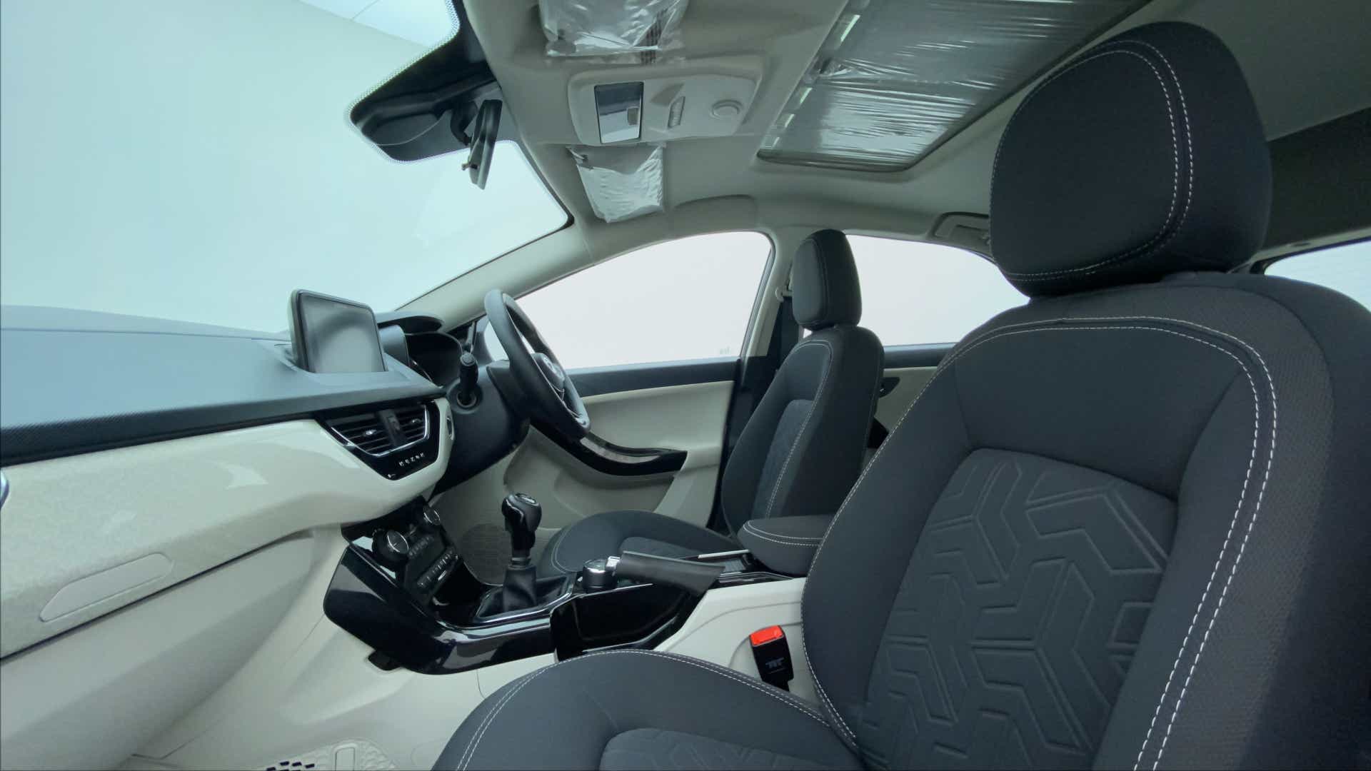 Interior front seats and dashboard of a Tata Nexon 2017-2023