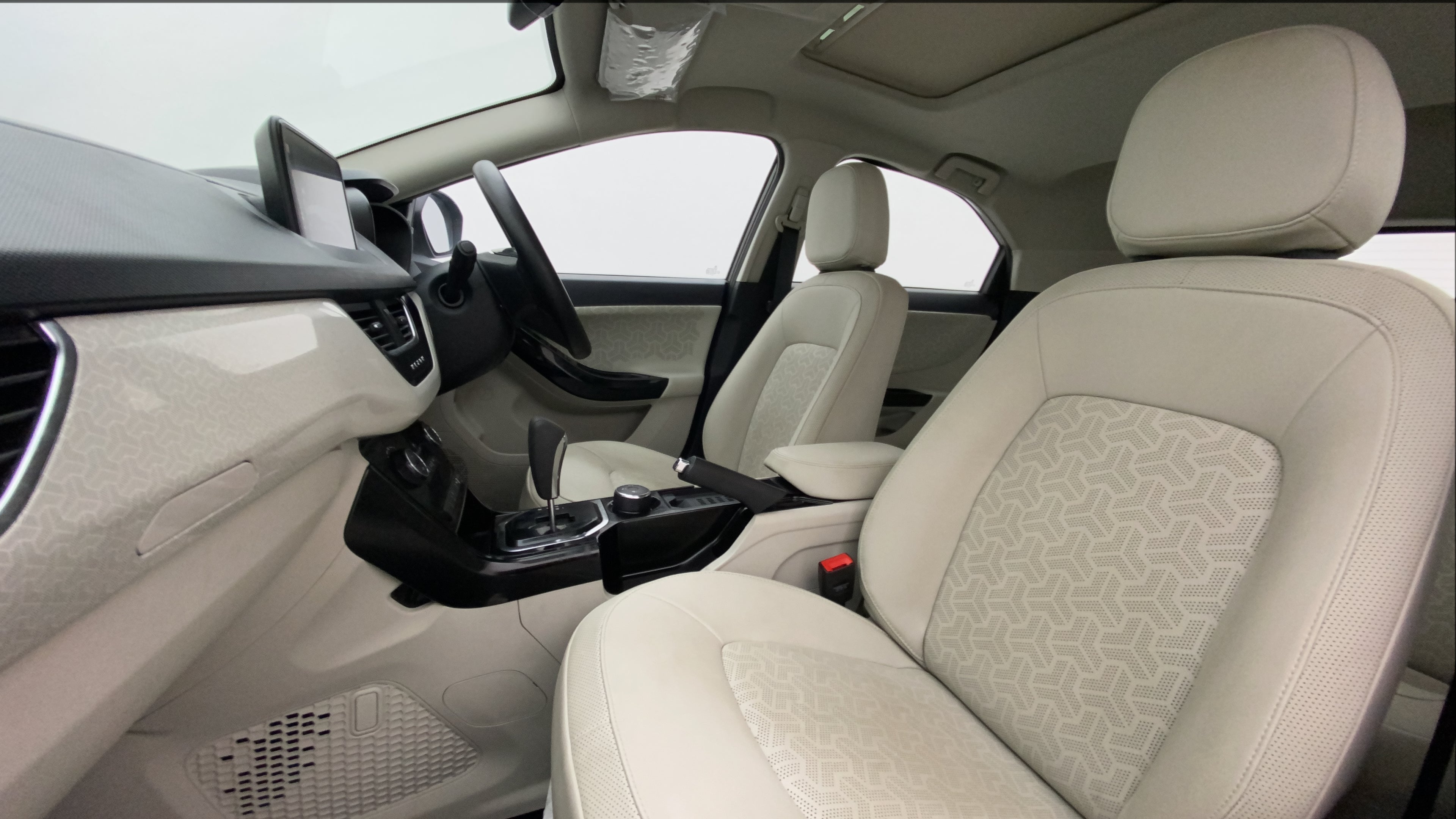 Interior front seats and dashboard of a Tata Nexon 2017-2023