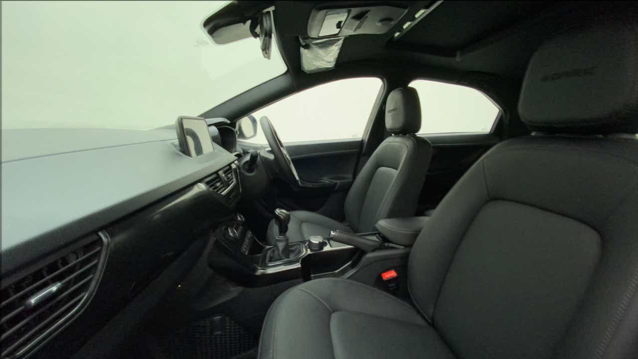 Interior dashboard and front seats of a Tata Nexon 2017-2023