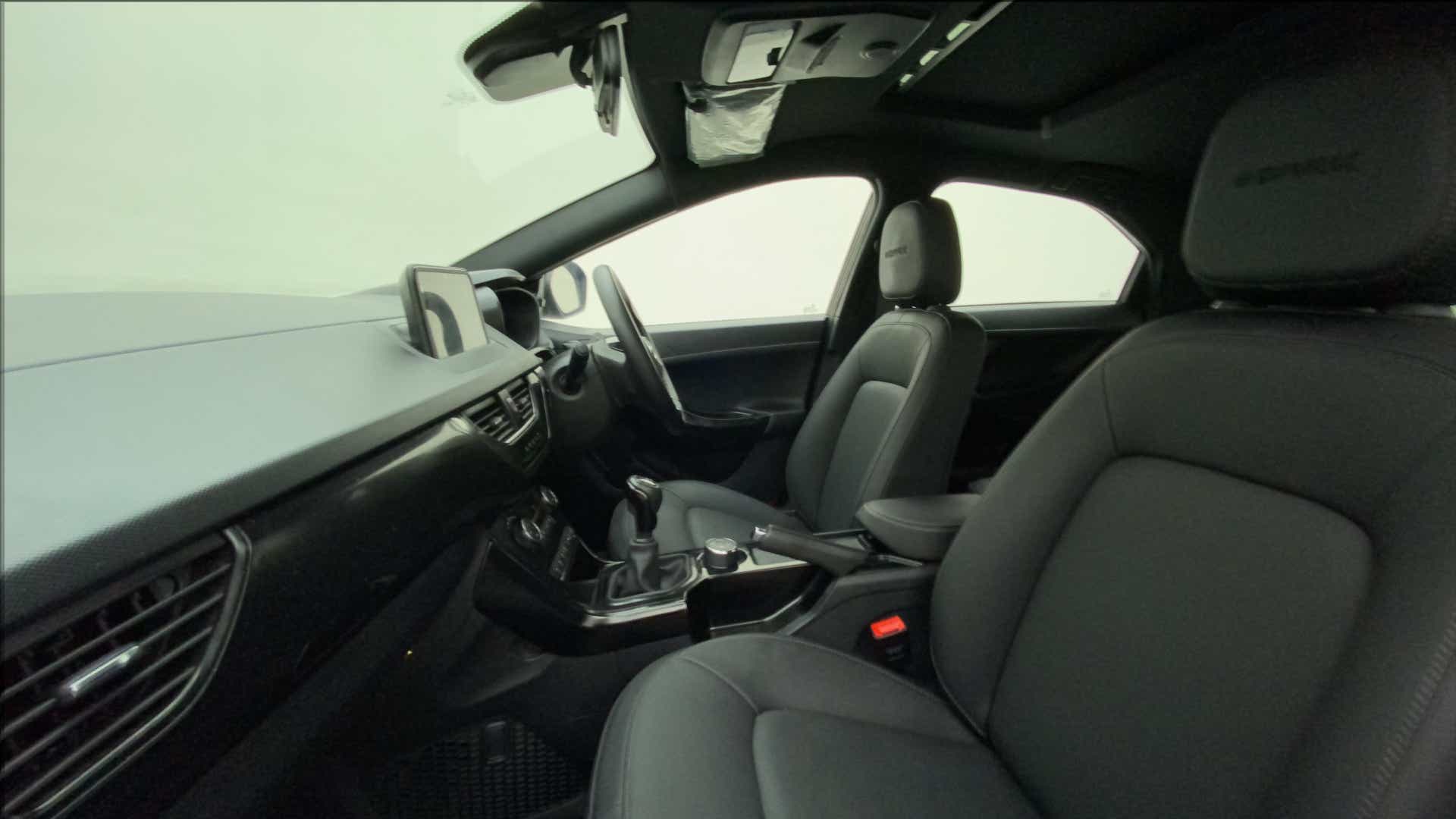 Interior dashboard and front seats of a Tata Nexon 2017-2023