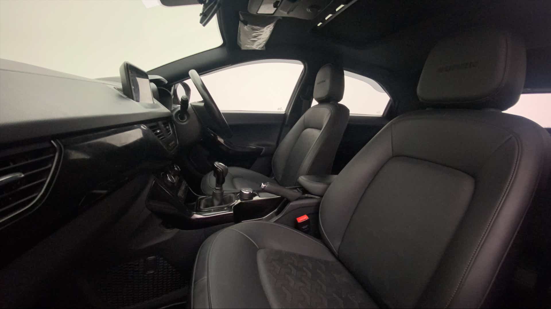 Interior dashboard and front seats of a Tata Nexon 2017-2023