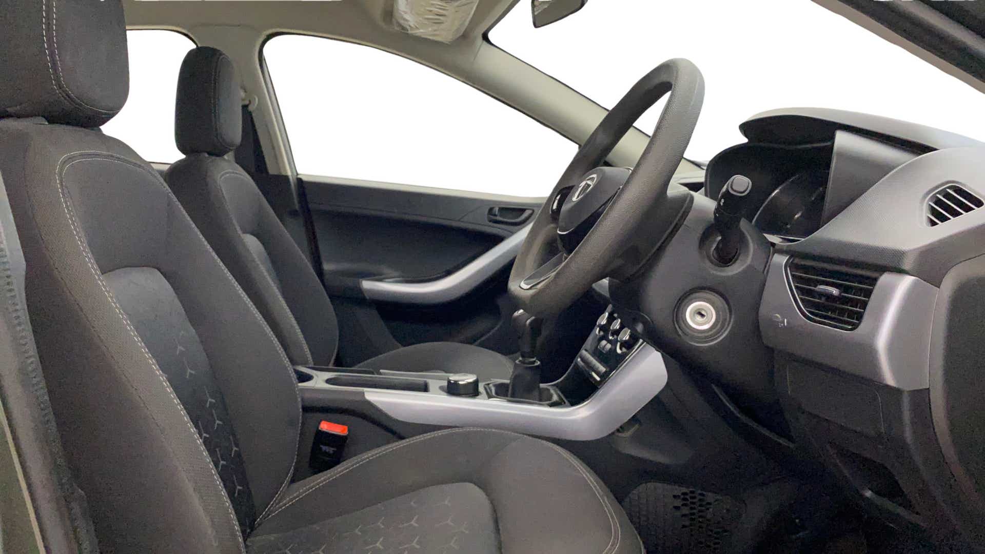 Interior dashboard and front seats of a Tata Nexon 2017-2023
