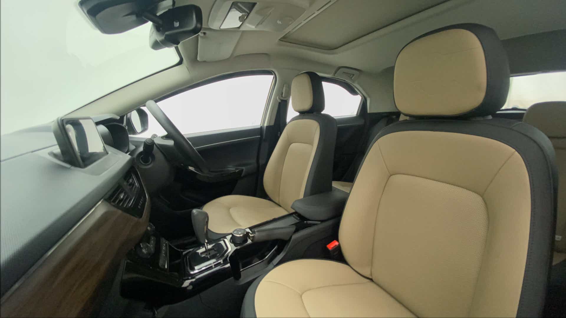 Interior front seat and dashboard view of a Tata Nexon 2017-2023