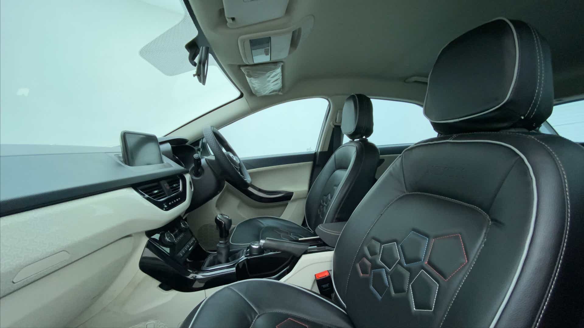 Interior dashboard and front seats of a Tata Nexon 2017-2023