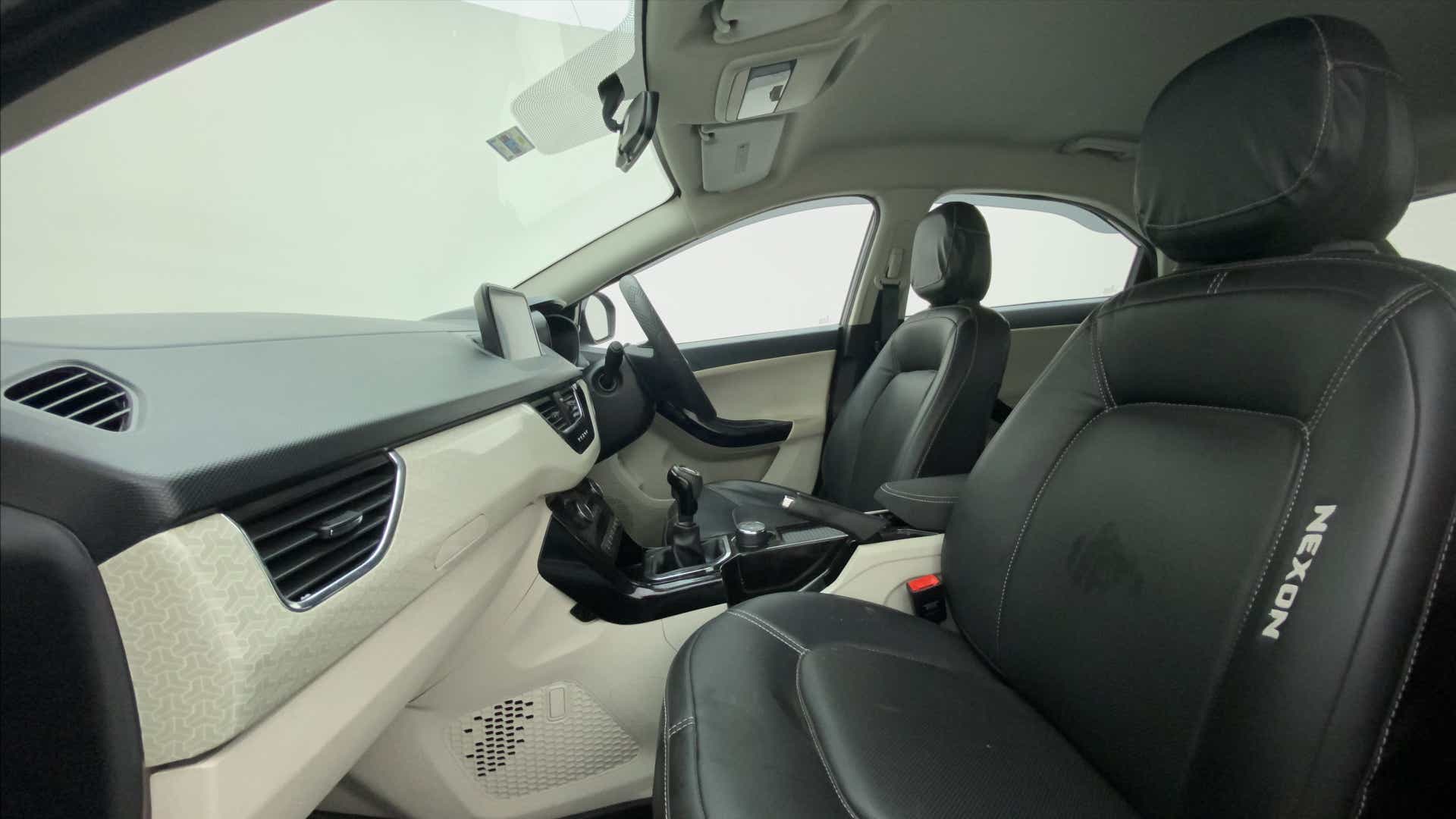 Interior dashboard and front seats of a Tata Nexon 2017-2023