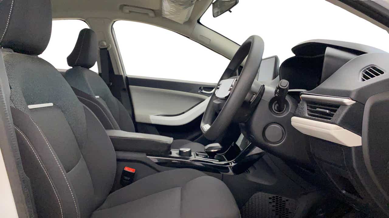 Interior front seat and dashboard view of a Tata Nexon