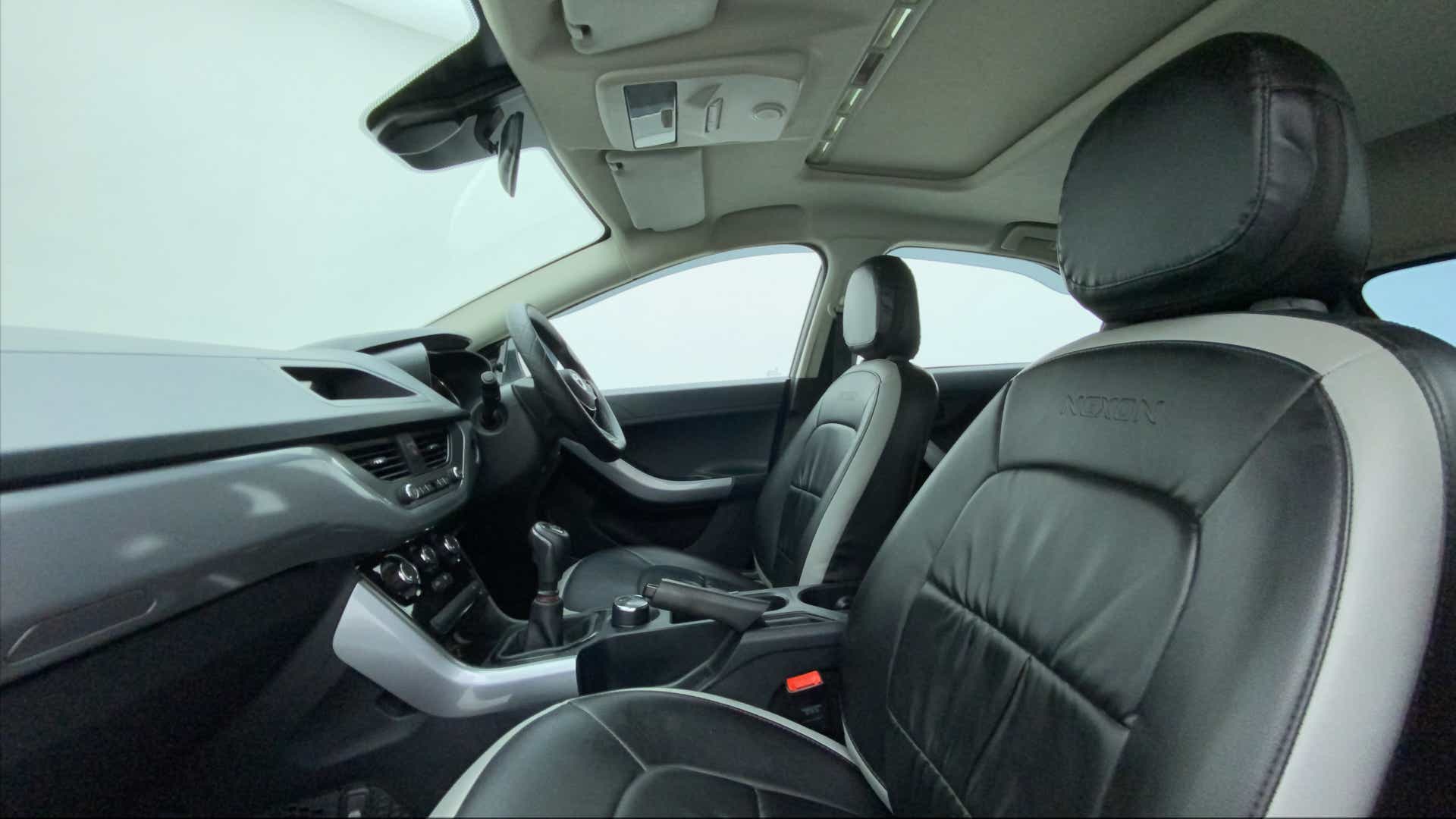 Interior dashboard and front seats of a Tata Nexon 2017-2023